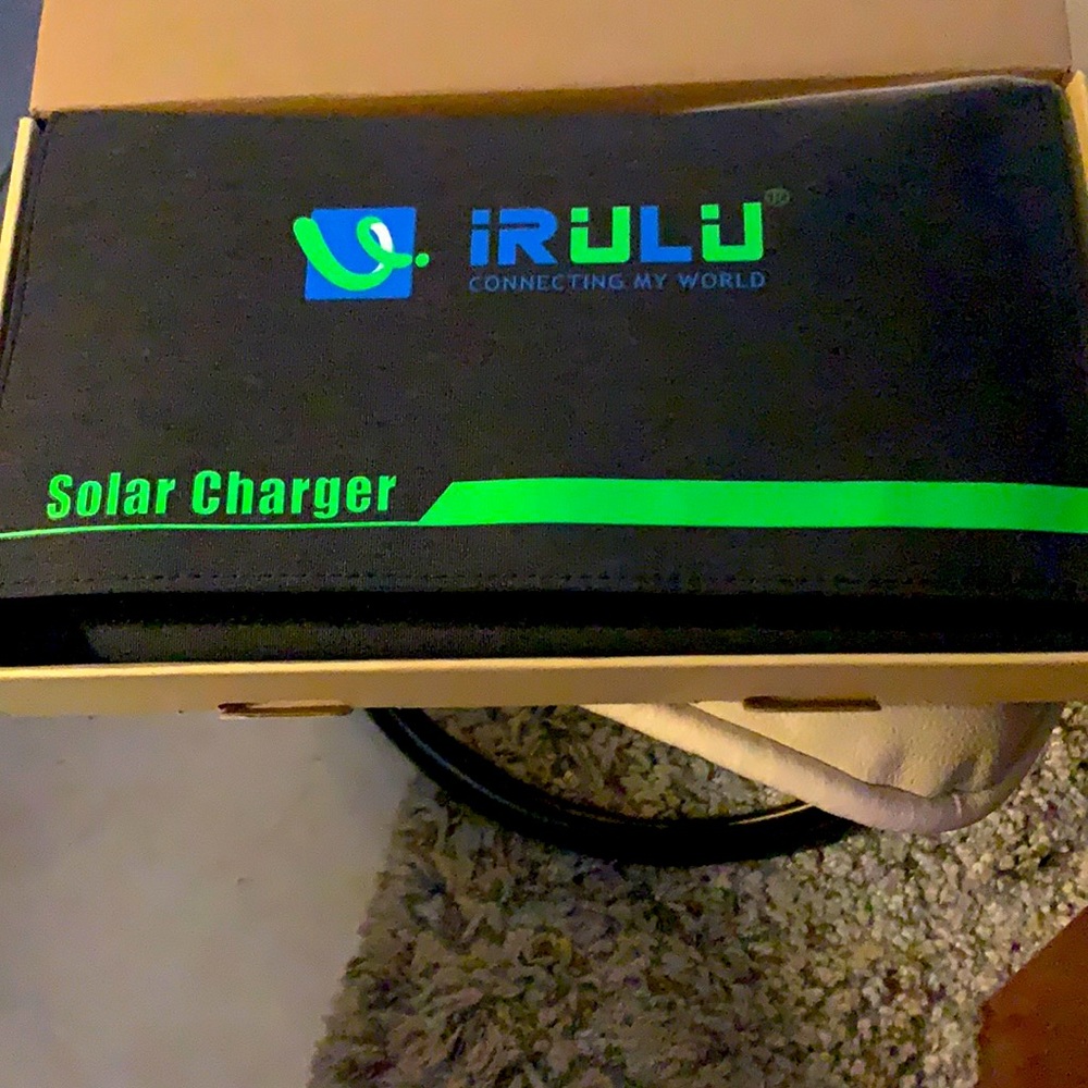 Portable solar charger for cell phone